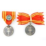 China medals, Manchuria, two Red Cross medals, gentlemen's with rosette and ladies' with bow ribbon.