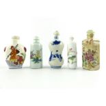 Collection of five Chinese porcelain snuff bottles and stoppers