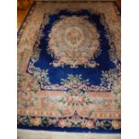 Chinese sculpted rug, the foliate design on a blue ground, 265cm w