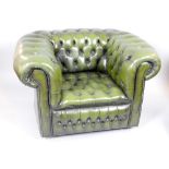 Pair of Chesterfield club armchairs upholstered in deep buttoned green leather wirth studded scroll