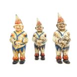 Three cast metal polychrome painted money boxes, modelled in the form of clowns.