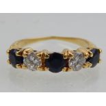 18ct yellow gold five stone diamond and sapphire ring