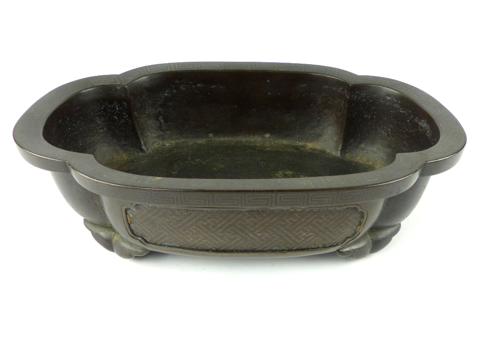 Chinese bronze incense burner, of lotus form, Greek key border, and engraved floral design to sides,