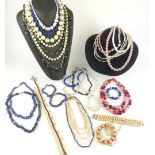 A large collection of necklaces, etc, comprising strings of freshwater and simulated pearls, strings