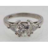 Platinum and diamond dress ring, central old cut stone flanked by trillion cut diamonds, diamonds of