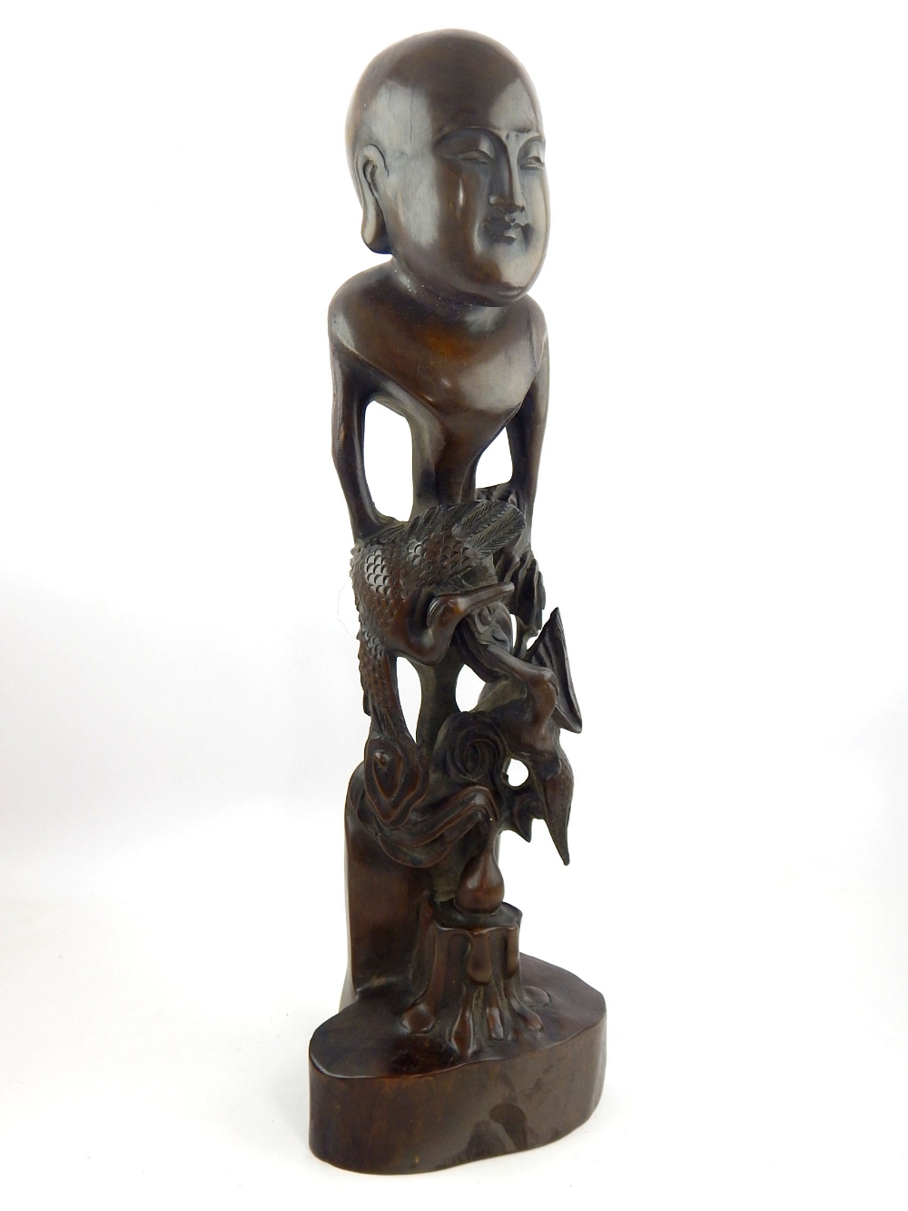 Contemporary Chinese hardwood carving, modelled in the form of a stylised figure and two cranes,