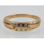 9ct yellow gold diamond set dress ring with plaque mount.