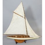 Victorian style scale model pond yacht, with linen sail, cream and red painted band to hull, 119cm h