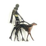 Art Deco style white metal brooch modelled in the form of a lady walking a dog, stamped 925