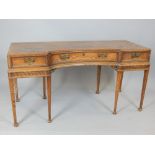 A 19th C inverted bow front pine table with three drawers and raised on six chamfered tapering legs,