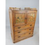 A 19th C Gothic inspired pine dwarf linen press with chinoiserie decoration and two cupboards