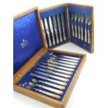 Sheffield silver six place fruit knives and forks 1924 and a Mappin and Webb oak six place set.