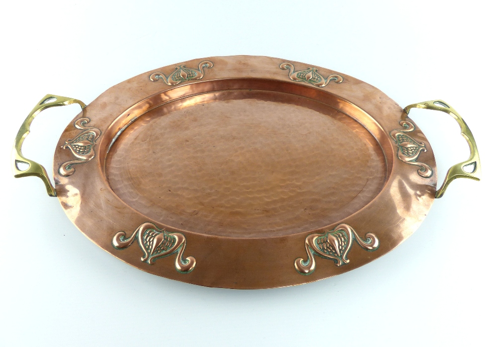 Newlyn style oval copper and brass tray with embossed rim,