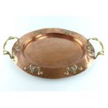 Newlyn style oval copper and brass tray with embossed rim,