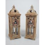 Pair of aged metal Gothic style candle lanterns with ring handles.