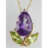 9ct yellow gold amethyst and peridot flowerhead pendant on fine link chain.