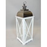 Large white painted candle lantern with polished metal arched top, 92cm h.