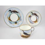 Late 19th century Worcester style trio set, decorated with seabirds.