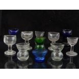 Eleven late 19th and early 20th century various clear and blue glass eye baths.