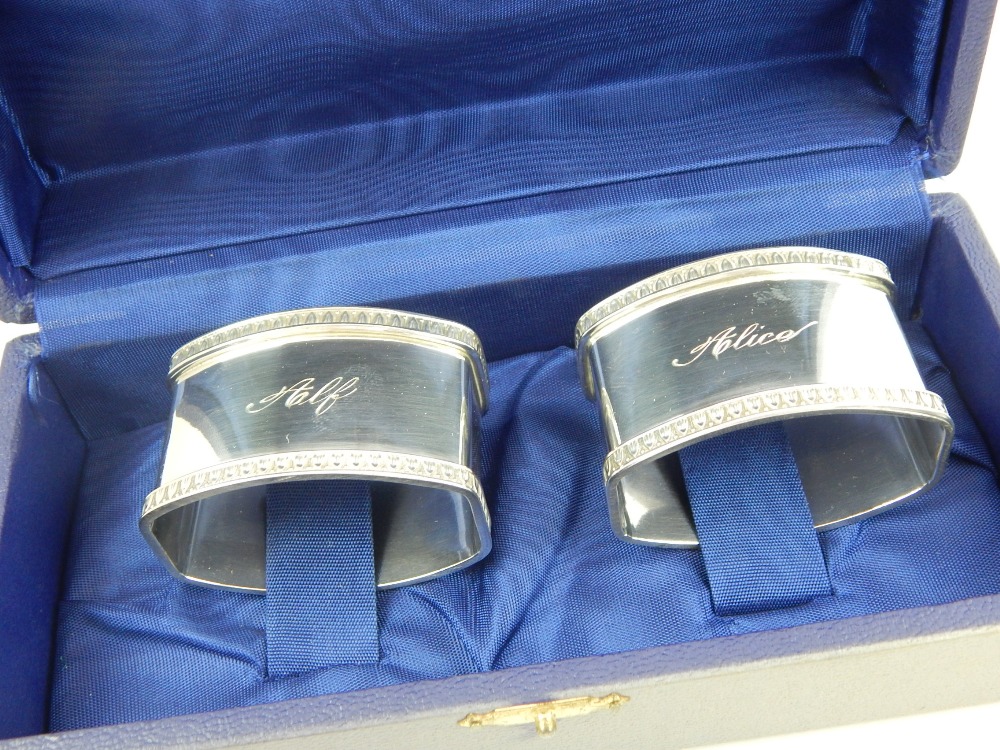 Eight cased silver napkin rings, George V and later, includes three pairs, - Image 3 of 6