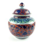 Chinese polychrome decorated ginger jar and cover, with scrolling foliate design,