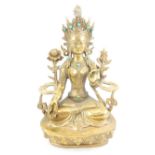 Cast brass Buddhist figure, seated with a crown and jewellery set with turquoise,