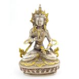White metal plated figure of Vajrasattva, seated wearing a gilt crown, 14.