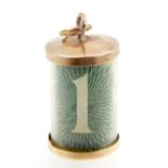 A 9ct yellow gold charm with cylindrical glass tube containing and old £1 note