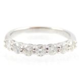 An 18ct white gold 7 stone diamond ring. Total diamond weight is 0.