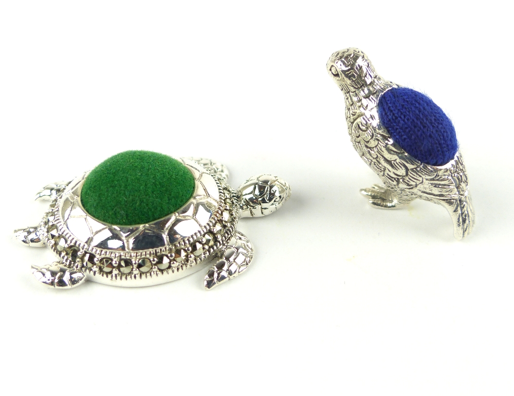 White metal pin cushion in the form of a turtle, together with another of a game bird.