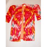 Mid 20th century ikat coat, predominantly red with gold, pink,