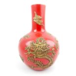 Chinese red ovoid vase, applied golden dragons chasing a flaming pearl, character stamp to base. 16.