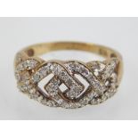 9ct yellow gold, diamond set, openwork band.