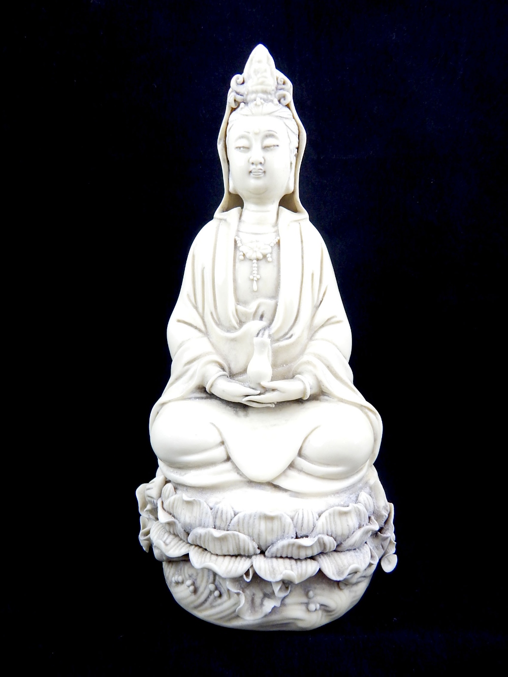 Chinese blanc de chine figure, study of Guan Yin holding a vase seated on giant lily pad, - Image 2 of 6