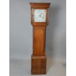 A Georgian oak and crossbanded longcase clock, the painted dial with a Roman numeral chapter ring,
