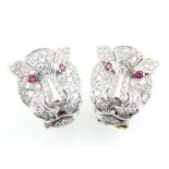 A pair of diamond and ruby earrings modelled as cougars in white gold,