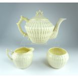 Belleek Irish china, Limpet pattern tea pot, cream and sugar.