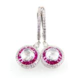 A pair of 18ct white gold ruby and diamond earrings. Central round rose cut diamond x2 1.01ct total.