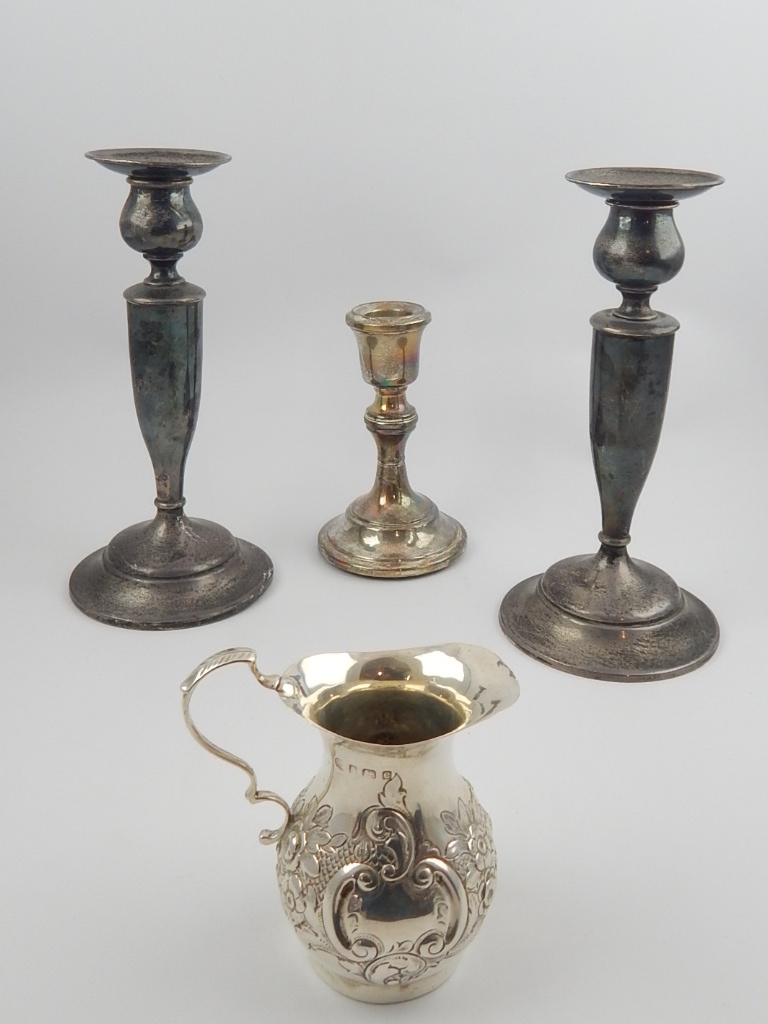 Sterling silver pair of candlesticks,