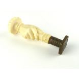 Oriental ivory and brass seal, pumpkin rib finial over a hand holding the seal, c 1930.