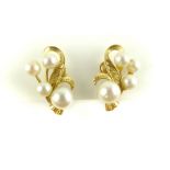 Pair of cluster pearl ear clips, on a gold foliate setting, stamped 14k, 4.