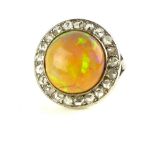 Opal and diamond set dress ring, set in a white metal band, 6.