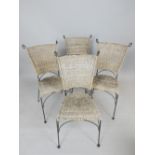 Four contemporary wrought steel and cane upholstered garden chairs. (4)