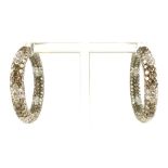 Pair of diamond hoop ear rings, by David Morris, the coloured diamond set in 18ct white gold, 27.