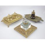 Three continental late 19th Century brass inkwells: desk top pieces,