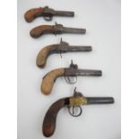 Five 18th/19th C pocket pistols, percussion cap tiring, mahogany walnut grips, 3/8" gauge,