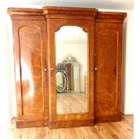 Late Victorian burr walnut breakfront wardrobe, central mirror door with glass handle enclosing