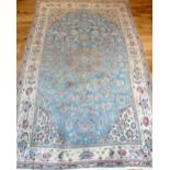 Persian Nain carpet, traditional floral design over cream and light blue ground, star medallion to