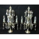 Pair of modern silver plated and glass table lamps / lustres, each decorated with faceted cut