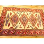 Persian Shirvan carpet, Greek key bordered medallions over geometric cream ground, stepped